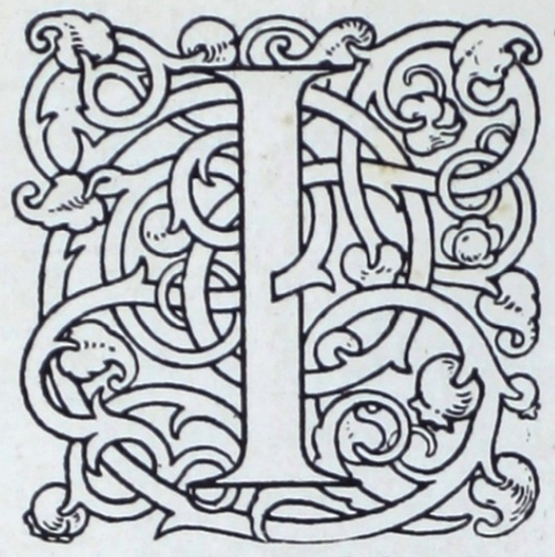 The square shape around the seriffed letter I is formed out of interlacing ribbons with terminal foliation of acanthus leaves and pomegranate buds. The decoration is created in thin black lines, leaving the letters, vines, and leaves white. It appears to be a wood engraving.